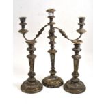 A plated candelabra and two candlesticks Will require some attention.