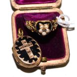 An 18ct gold mourning locket ring, a heart shaped head inset with a diamond, seed pearls and black