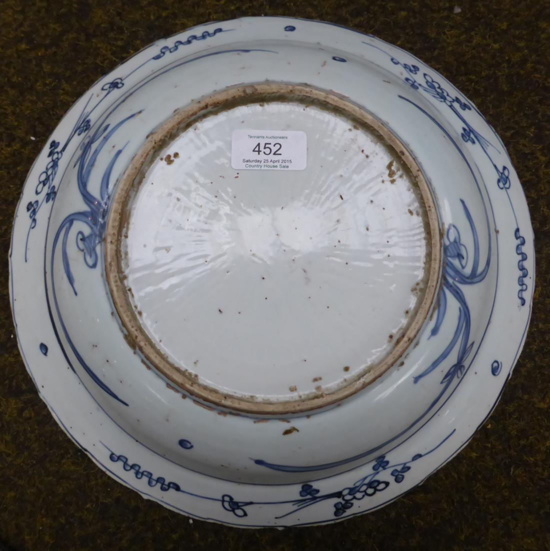 A Chinese porcelain circular dish, early 17th century, painted underglaze blue with ducks on a - Image 6 of 8