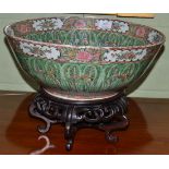 A Cantonese porcelain punch bowl, late 19th century, decorated with butterflies on leaves, 39cm
