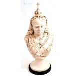 A cast stone bust of Queen Victoria, no date, wearing a crown and sash, on circular base and