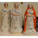 A Staffordshire pottery figure of Queen Victoria, circa 1890, wearing regal robes, the base