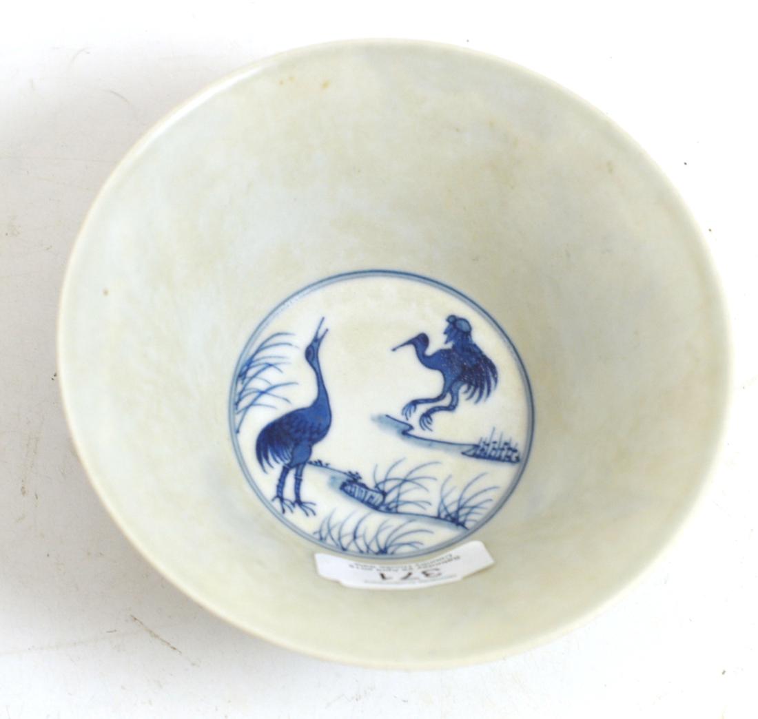 A Chinese porcelain bowl, decorated with four cranes flying amidst clouds and pine trees, bears - Image 2 of 7