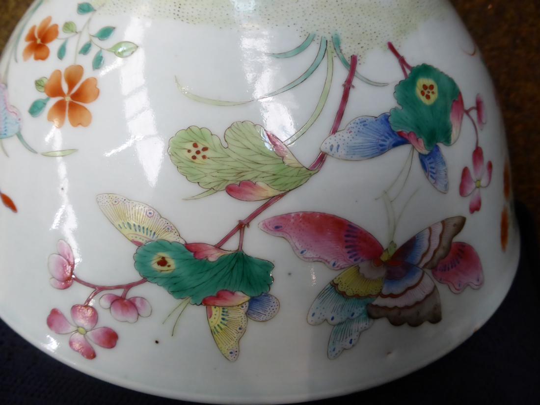 A Chinese porcelain bowl, painted in famille rose enamels with butterflies amongst foliage, bears - Image 6 of 7
