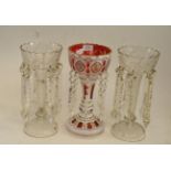 A Bohemian white overlay ruby glass table lustre with flower painted decoration and prismatic drops,