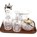 A silver plated and cut glass claret jug, two decanters with stoppers, cut glass vase and a silver-