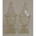 A pair of cut glass urns and covers Generally good condition, no big chips noted.