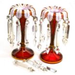 A pair of Bohemian white overlay ruby glass lustres, circa 1860, with leaf borders and spear