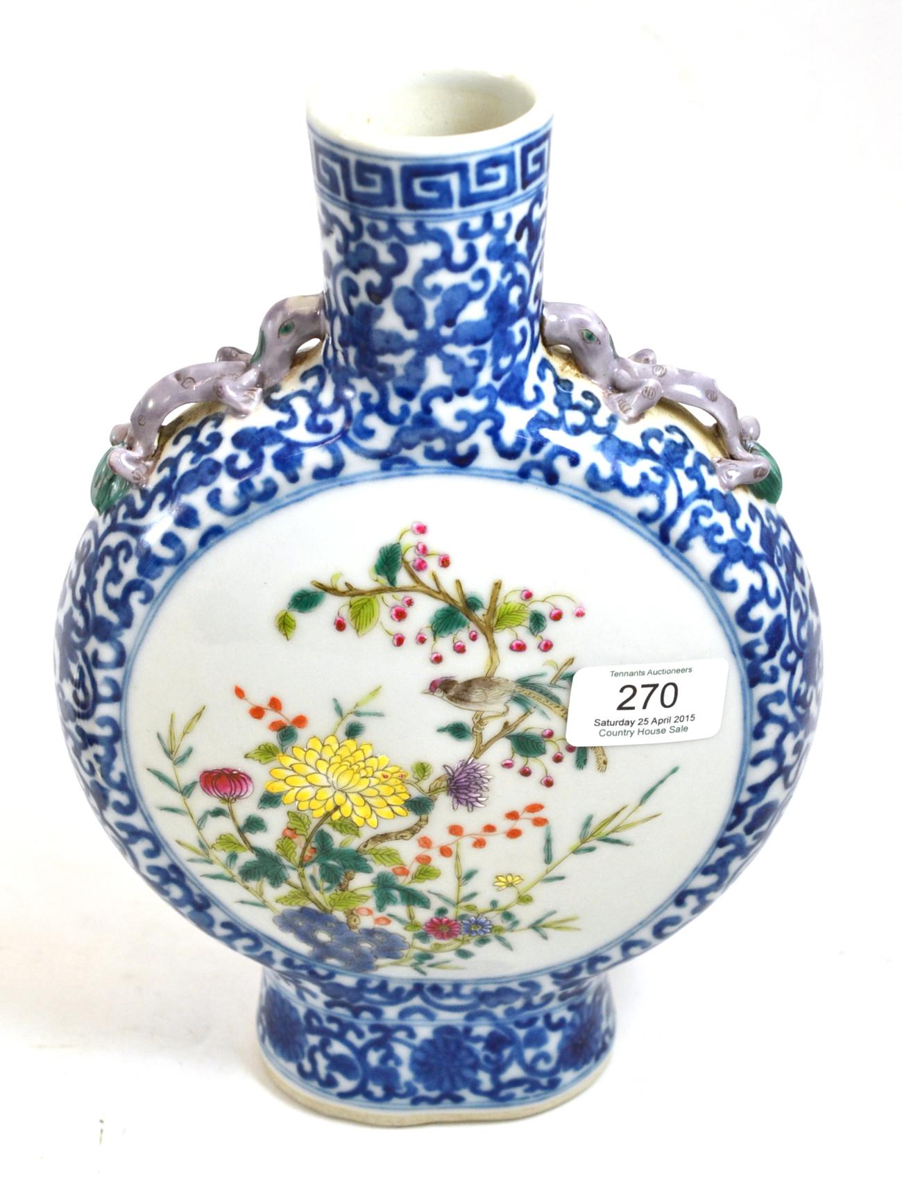 A Chinese porcelain moon flask, 19th century, painted with birds and branches on a blue scroll