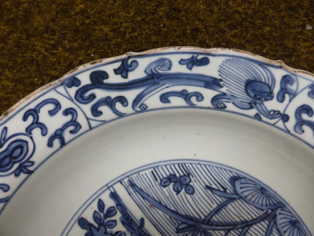 A Chinese porcelain circular dish, early 17th century, painted underglaze blue with ducks on a - Image 5 of 8