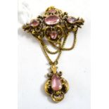 A Victorian brooch, a quatrefoil section inset with five foil backed oval cut quartz, to swag