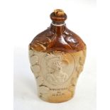 A brown salt glaze stoneware flask, circa 1837, of flattened baluster form, moulded with titled bust