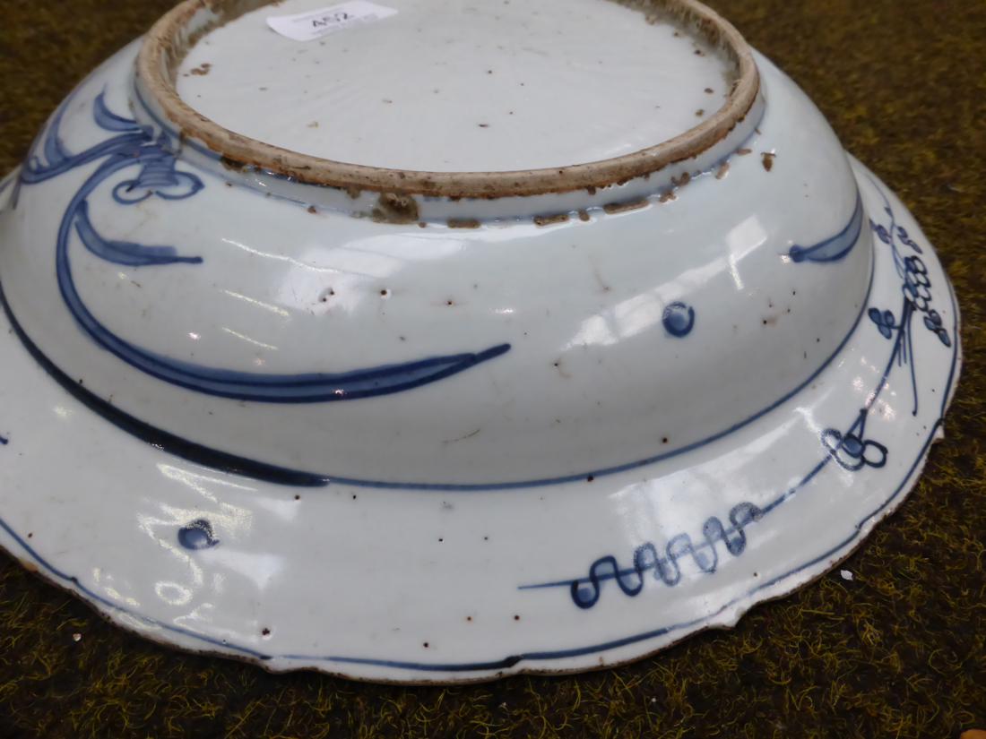 A Chinese porcelain circular dish, early 17th century, painted underglaze blue with ducks on a - Image 8 of 8