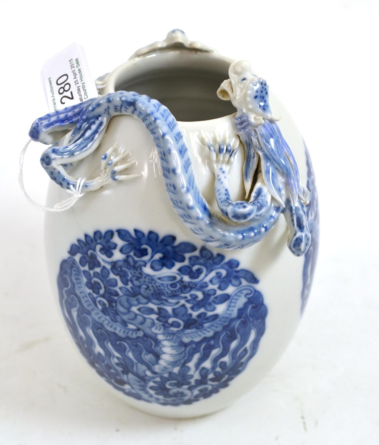 Chinese porcelain ovoid vase, shoulder applied with a dragon, painted underglaze blue with phoenix