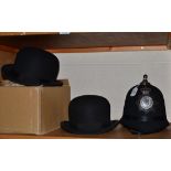 Two bowler hats and a police helmet