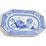 A Chinese porcelain meat platter, Quianlong, of canted rectangular form, painted underglaze blue