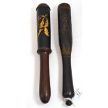 A Victorian truncheon gilt with VR monogram on a blue ground, 31cm long; and a similar truncheon