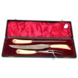 Three piece carving set, circa 1890, the ivory handles set with gilt crowned V R monogram, cased