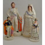 A Staffordshire pottery figure of Queen Victoria, circa 1887, standing wearing crown and robes,