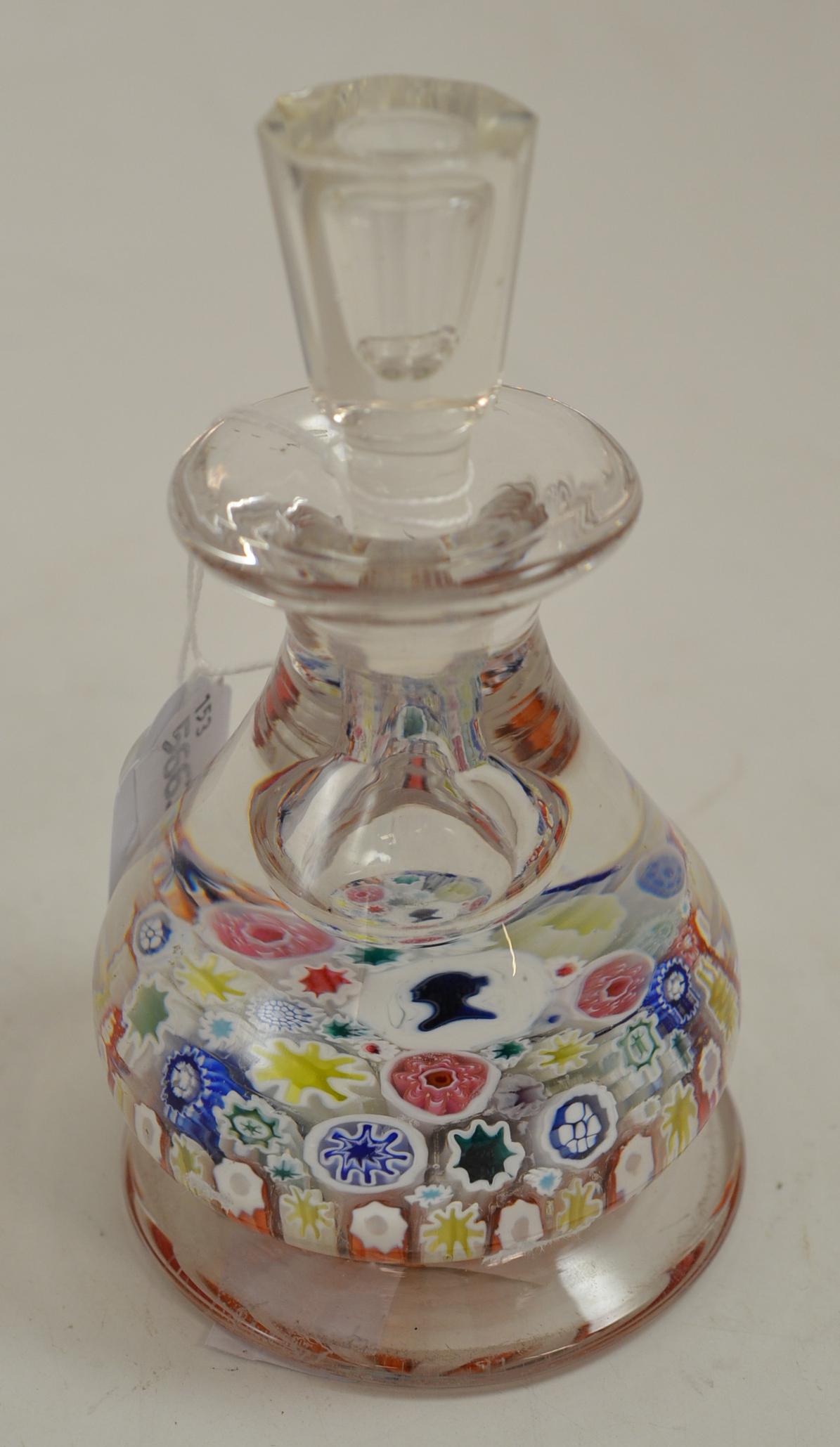 A millefiori glass inkwell and stopper, late 19th century, set with the young queen's head on a