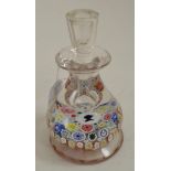 A millefiori glass inkwell and stopper, late 19th century, set with the young queen's head on a