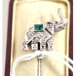 An emerald and diamond stick pin, in the form of an elephant, length 6cm, cased  Good condition.