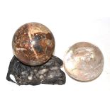 Rock crystal ball on rock crystal stand and breccia marble ball on stand Minor nibbles throughout,