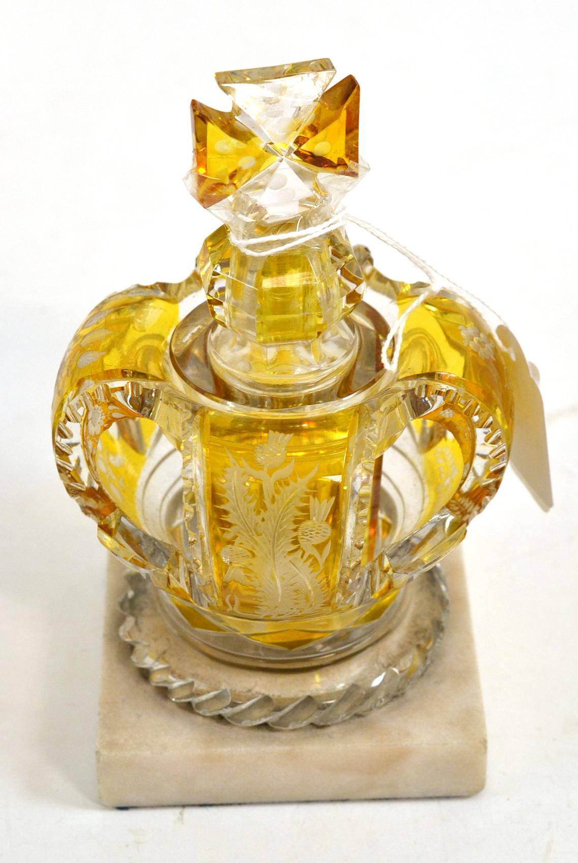 A Bohemian amber flashed scent bottle and stopper, circa 1880, modelled as a crown engraved with a