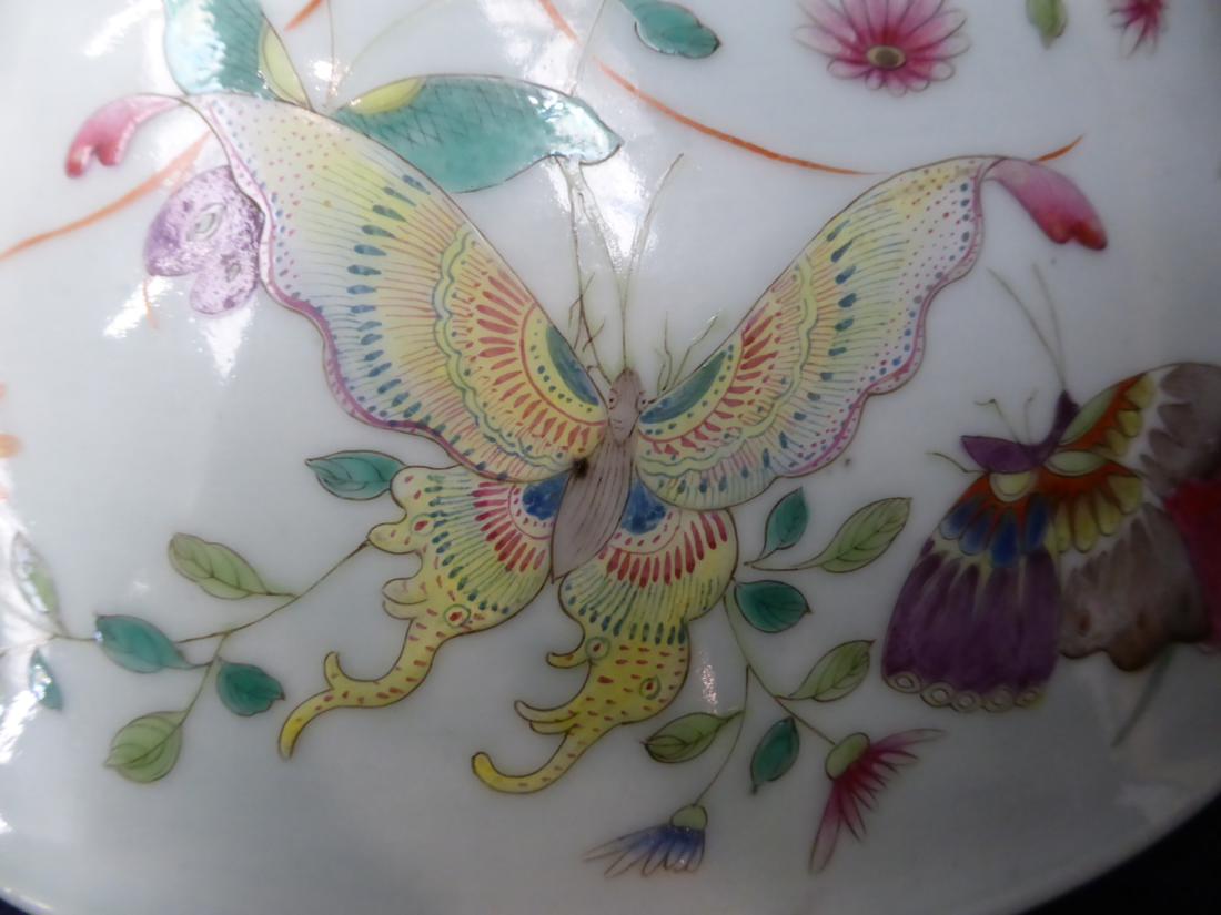 A Chinese porcelain bowl, painted in famille rose enamels with butterflies amongst foliage, bears - Image 5 of 7