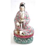 Chinese famille rose figure of Guanyin, 43cm high  Rubbing to gilding. Signed to base. Minor glazing