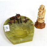 An onyx ashtray, surmounted with a fox and two cubs, together with a late 19th century carved