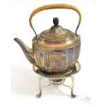 A Victorian silver tea kettle, stand and burner, London 1882, with caned handle and carved wood