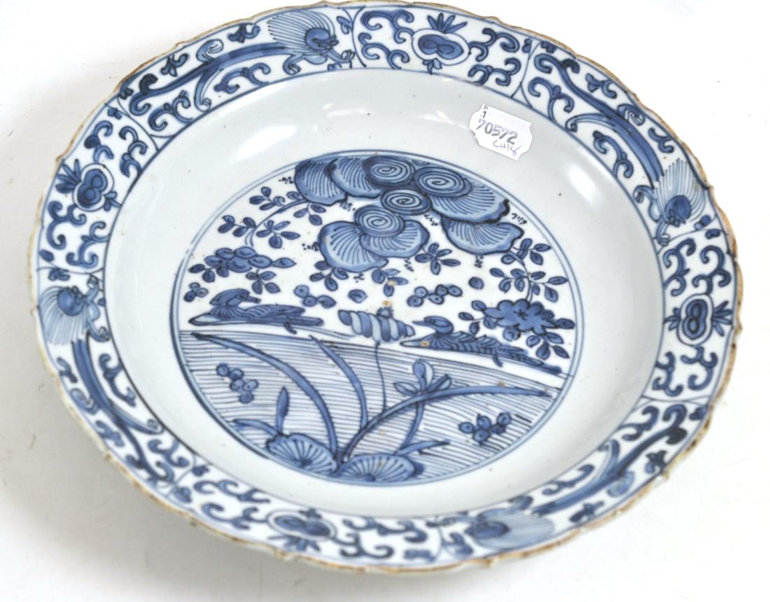 A Chinese porcelain circular dish, early 17th century, painted underglaze blue with ducks on a