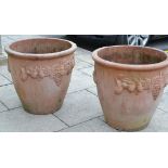 Pair of large terracotta planters decorated with vines and fruit, 65cm diameter