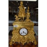 A gilt metal striking mantel clock, circa 1890, surmounted by a lady in costume, 3-inch enamel dial,