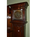 An oak longcase clock case, flat top pediment, 11-inch square brass dial with chapter ring inscribed