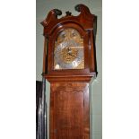 A chiming longcase clock, oak and mahogany case with a swan neck pediment, 12-inch arched brass dial