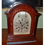 A chiming table clock, circa 1910, arched pediment, 7-inch arched dial, two dials for fast/slow