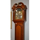 An oak eight day longcase clock, swan neck pediment, 12-inch brass dial bearing inscription Henry