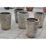 Five terracotta planters of assorted sizes, the smallest 52cm high and the largest 61cm high