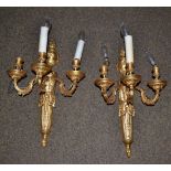 A pair of 20th century gilt metal wall mounted candelabra