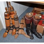 Pair of leather hunting boots with trees and three other pairs of boot trees