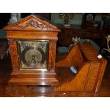 An oak chiming bracket clock with wall bracket, circa 1900, architectural pediment, pierced side