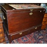 A George III mahogany hinged chest on stand fitted with two frieze drawers