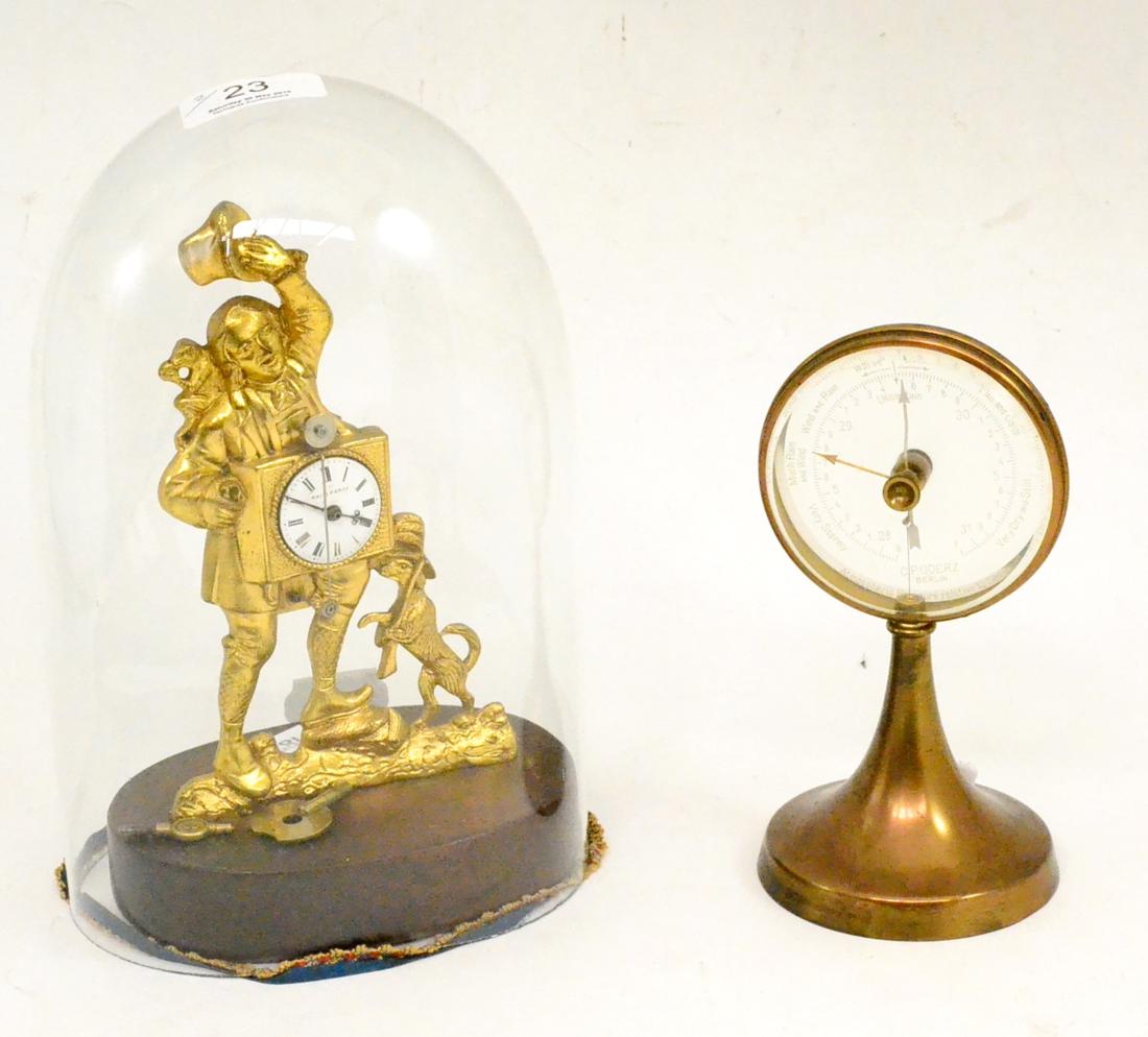 A figural gilt metal timepiece, signed Roi a Paris, beneath glass dome and a table barometer (2)