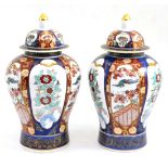 A pair of Chinese Imari vases and covers