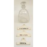 Royal Commemorative decanter and three pottery wine cellar labels