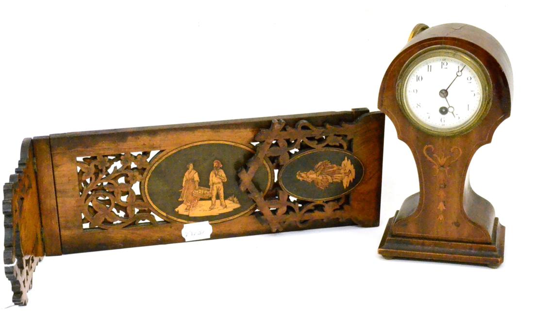 An inlaid Edwardian timepiece and a book stand