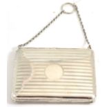 A silver card case/purse, William Greenwood & Sons, Birmingham 1938, with suspension chain