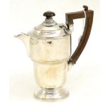 A silver hot water jug, Elkington & Co, Birmingham 1937